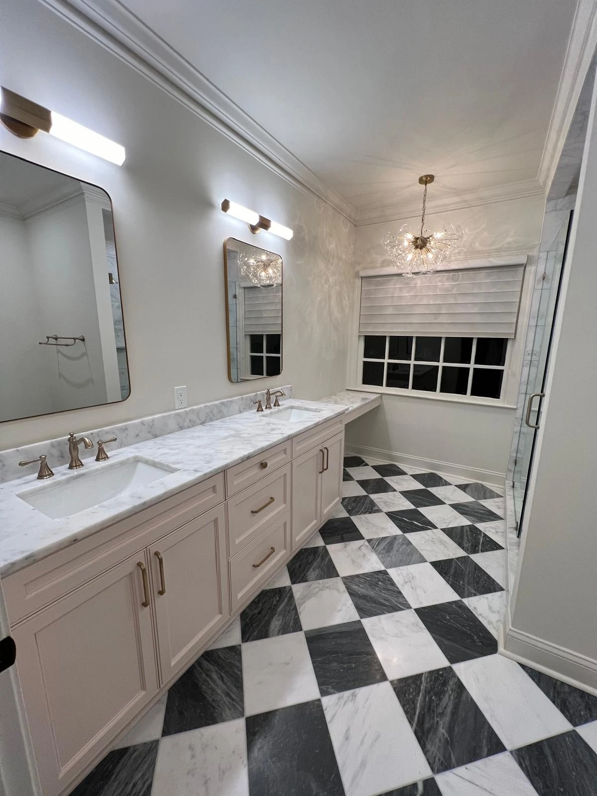 Double vanity with quartz counters over a black-and-white checkered tile floor — Deerfield Beach, FL