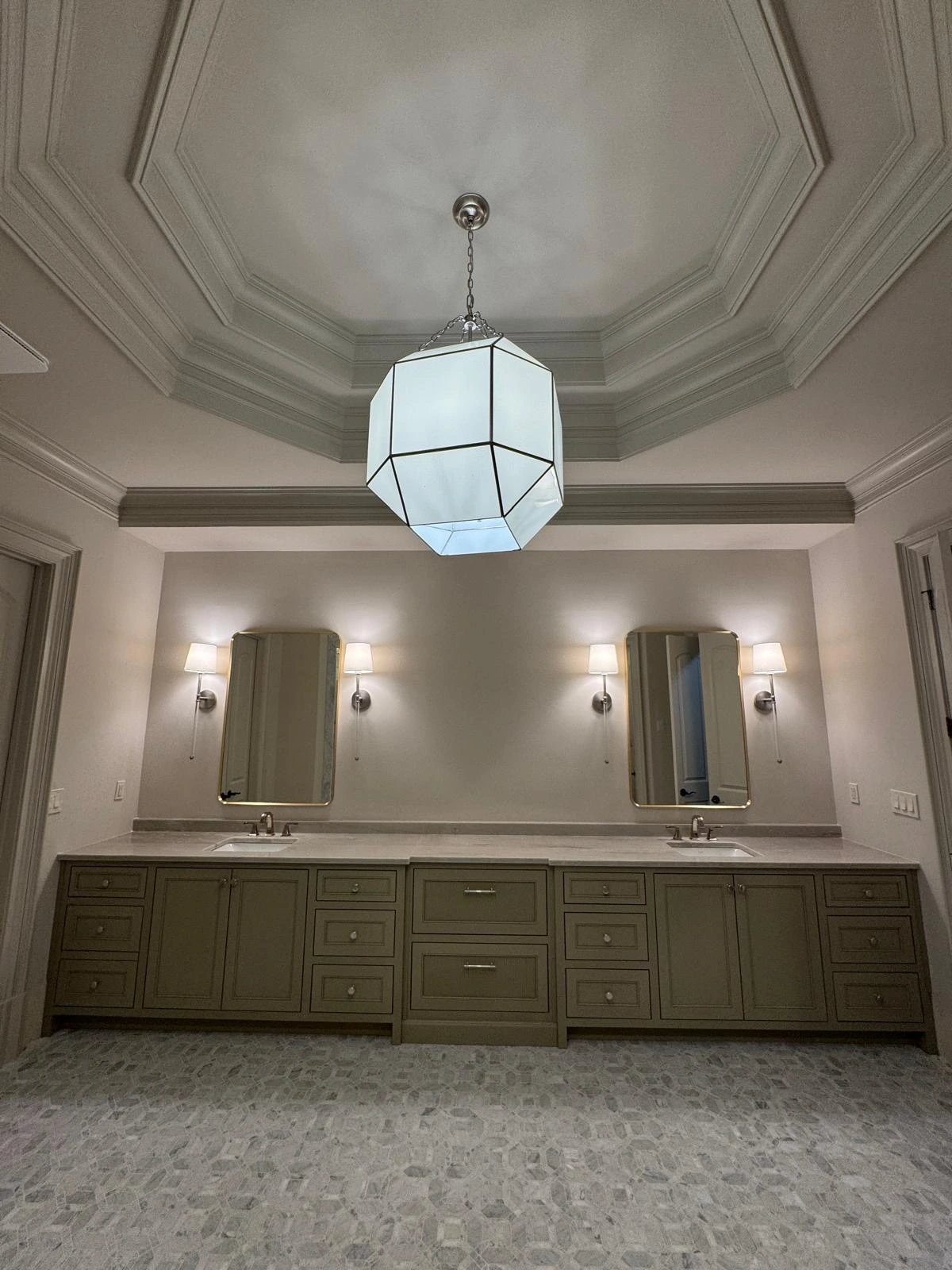 Double vanity with tray ceiling and pendant lighting in a master bathroom — Davie, FL