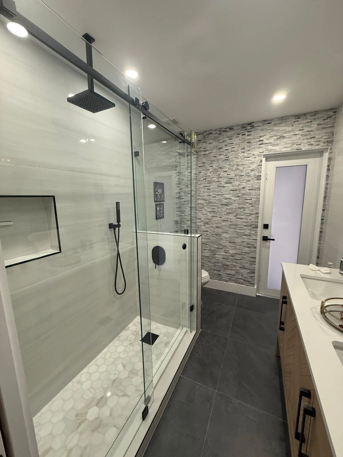 Full bathroom renovation with tiled shower and updated vanity — Fort Lauderdale, FL