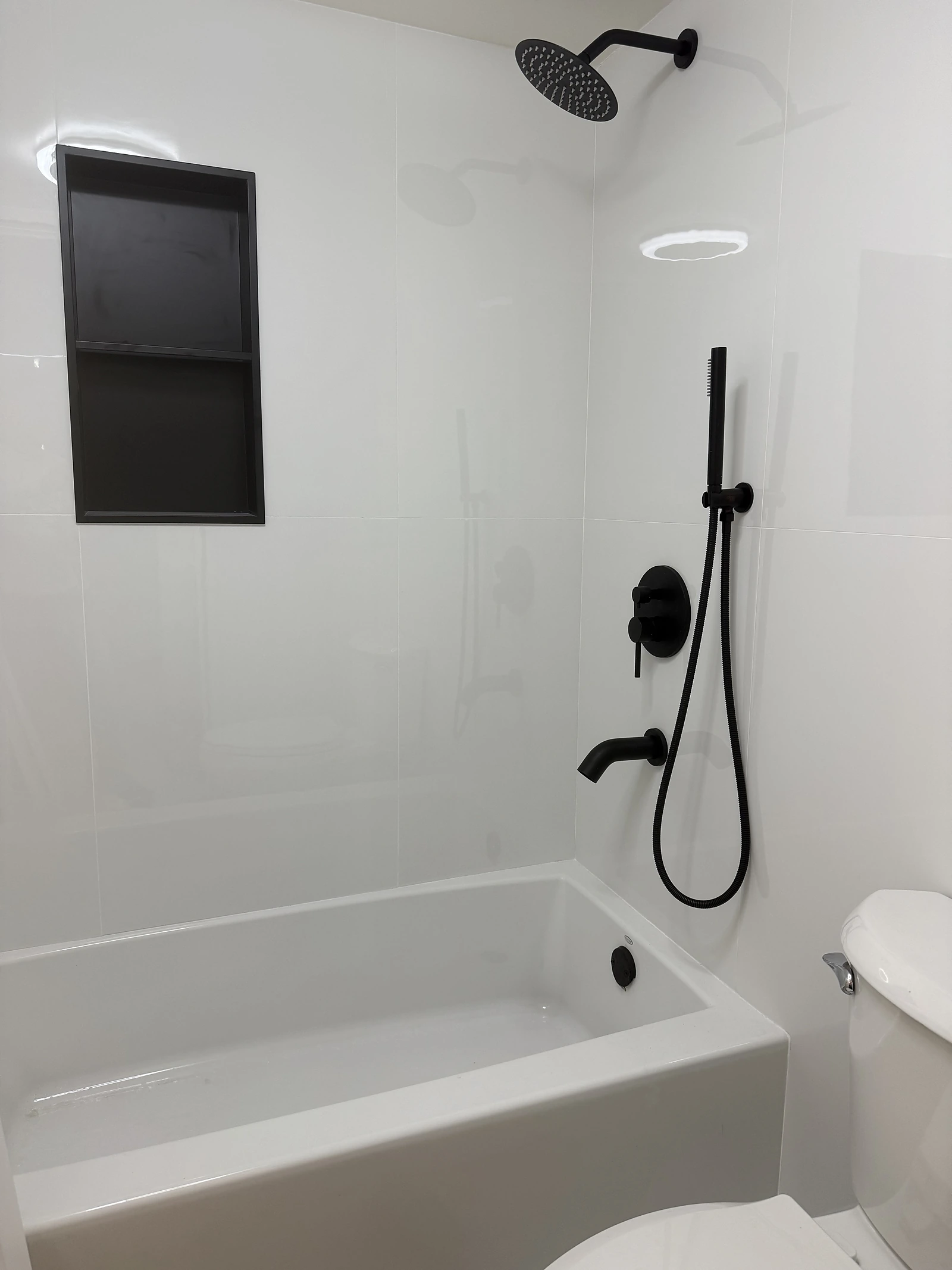 White tub-shower combination with matte black fixtures — Boca Raton, FL