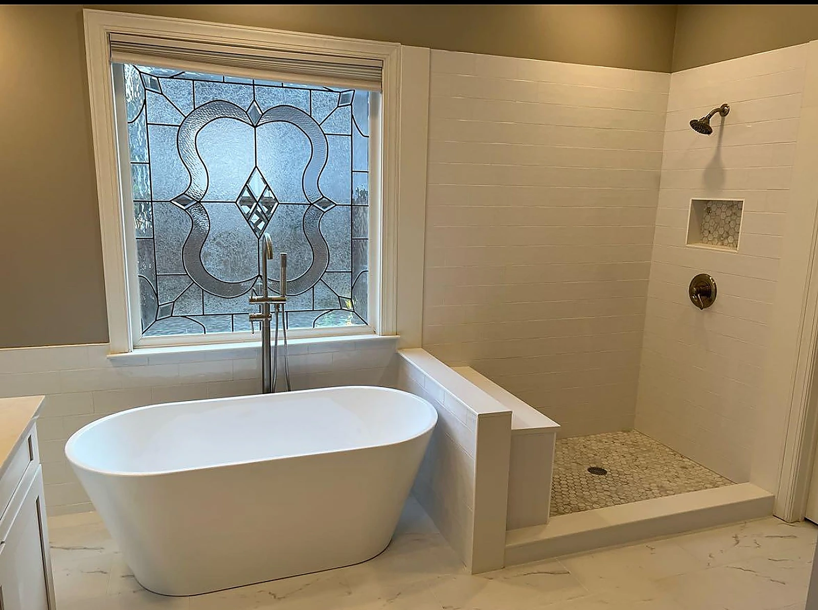 Freestanding tub in an alcove with stained glass window — Delray Beach, FL