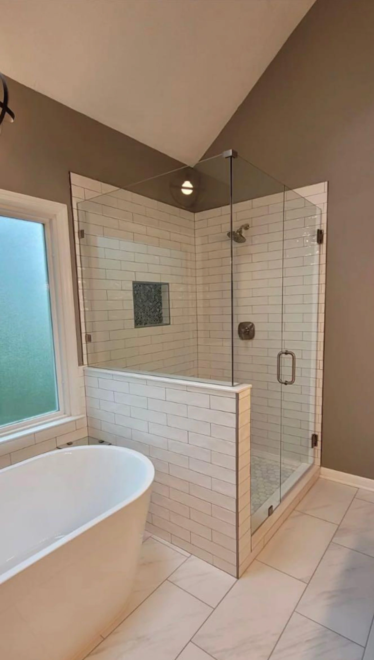 Soaking tub and white subway tile shower enclosure — Delray Beach, FL