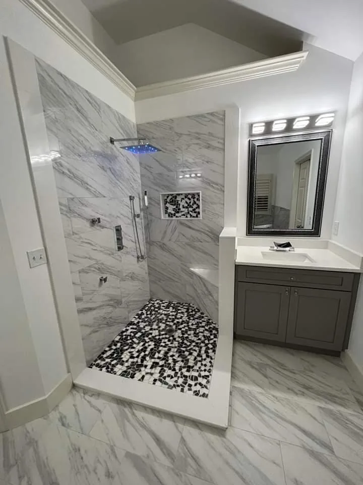 Marble shower with rainfall head, mosaic pan and floating vanity — Pompano Beach, FL