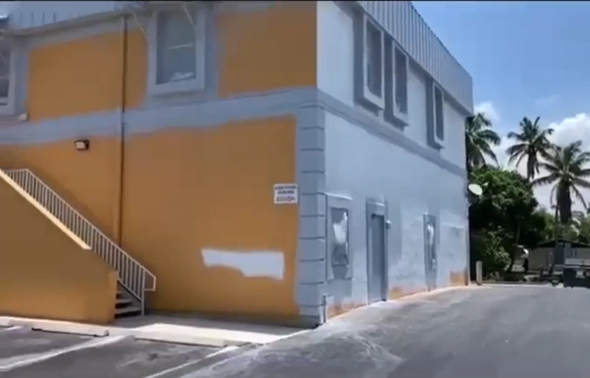 Exterior painting in progress - transition to new color in Boca Raton FL by Primer Star Corp