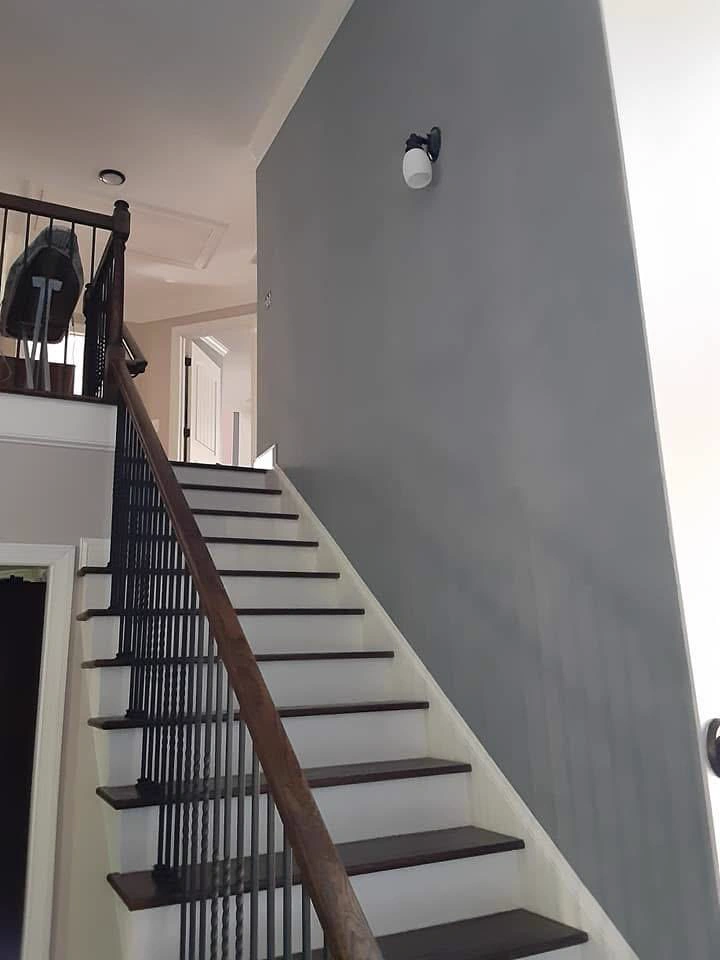 Interior accent wall painting with gray finish on staircase in South Florida by Primer Star Corp