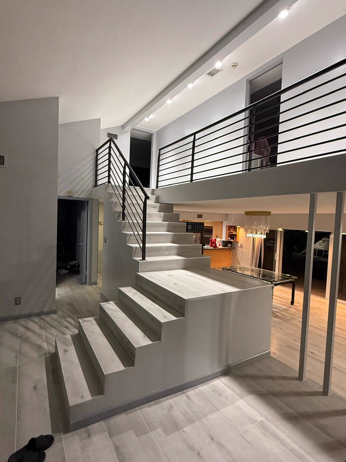 Modern staircase with clean white and gray interior paint in Weston FL by Primer Star Corp