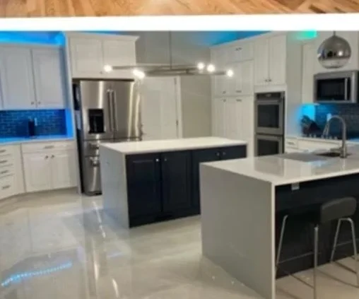 Kitchen after complete remodel by Primer Star Corp — modern cabinets, quartz countertops, and designer backsplash
