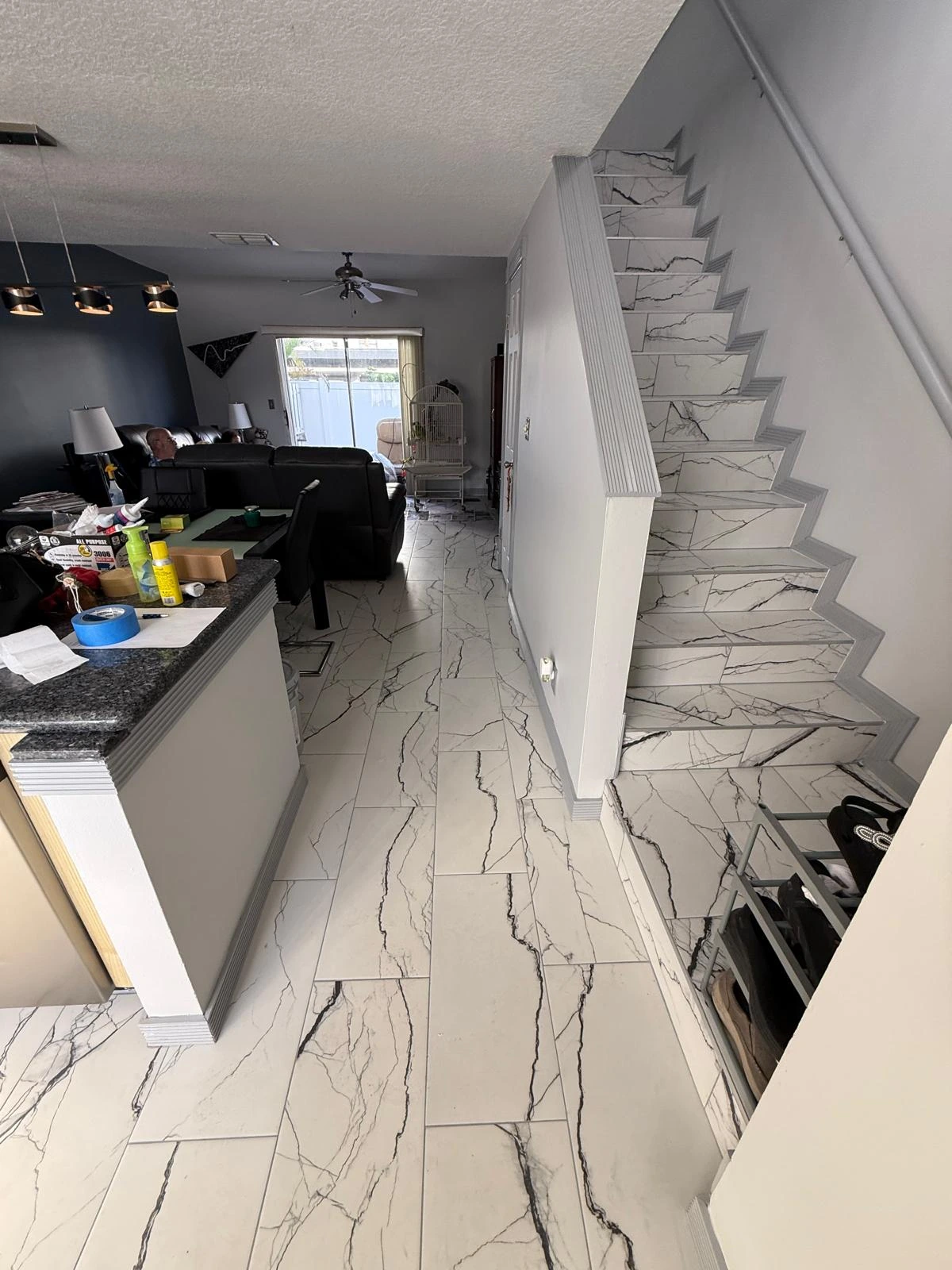 Marble-look porcelain flooring continuing up the staircase — Pembroke Pines, FL