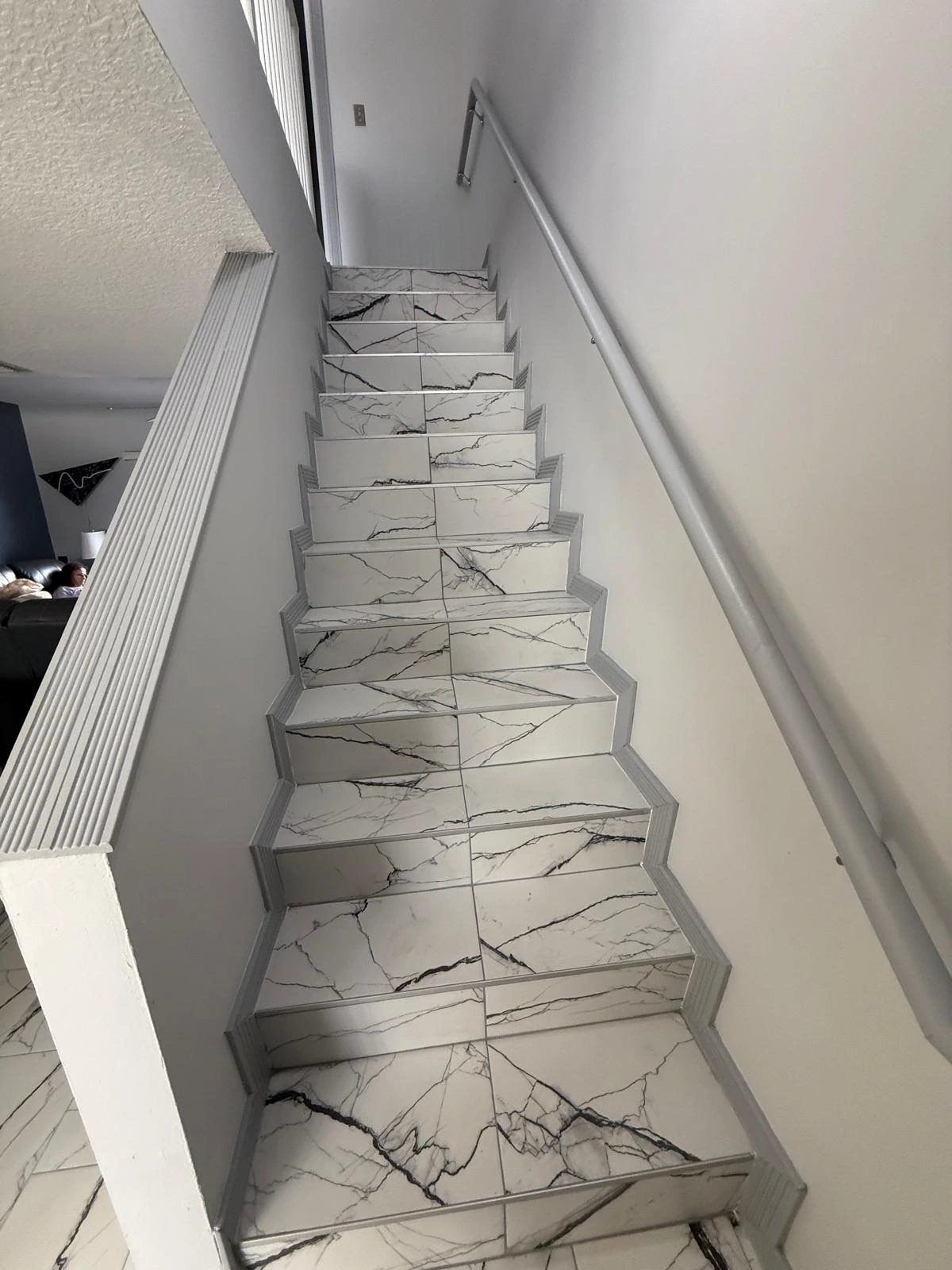 Staircase clad in marble-look porcelain tile — Pembroke Pines, FL